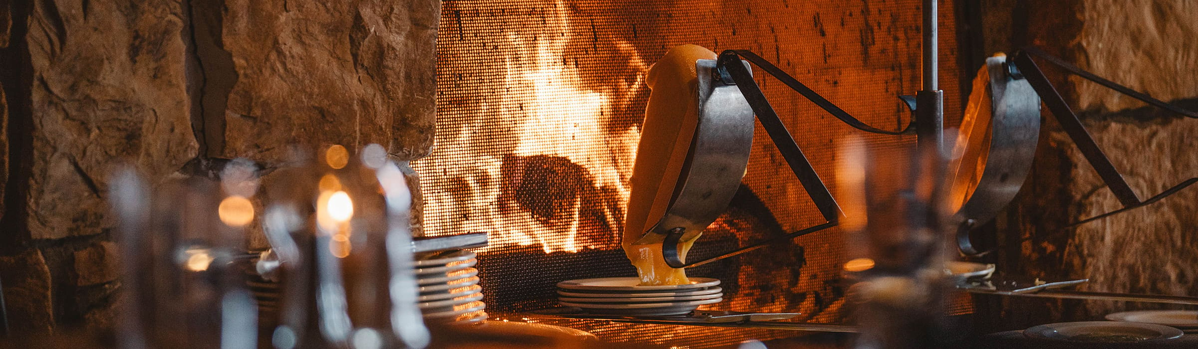 Cheese melting by the Fireside Dining fireplace at Deer Valley Resort.