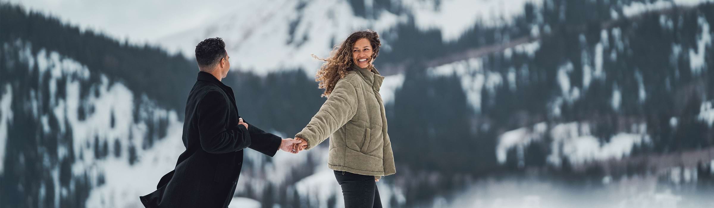 Couple holding hands at Deer Valley.