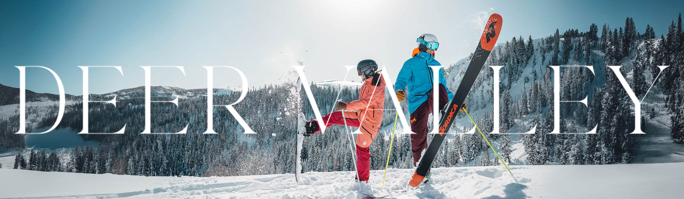 Two guests skiing at Deer Valley on a powder day.