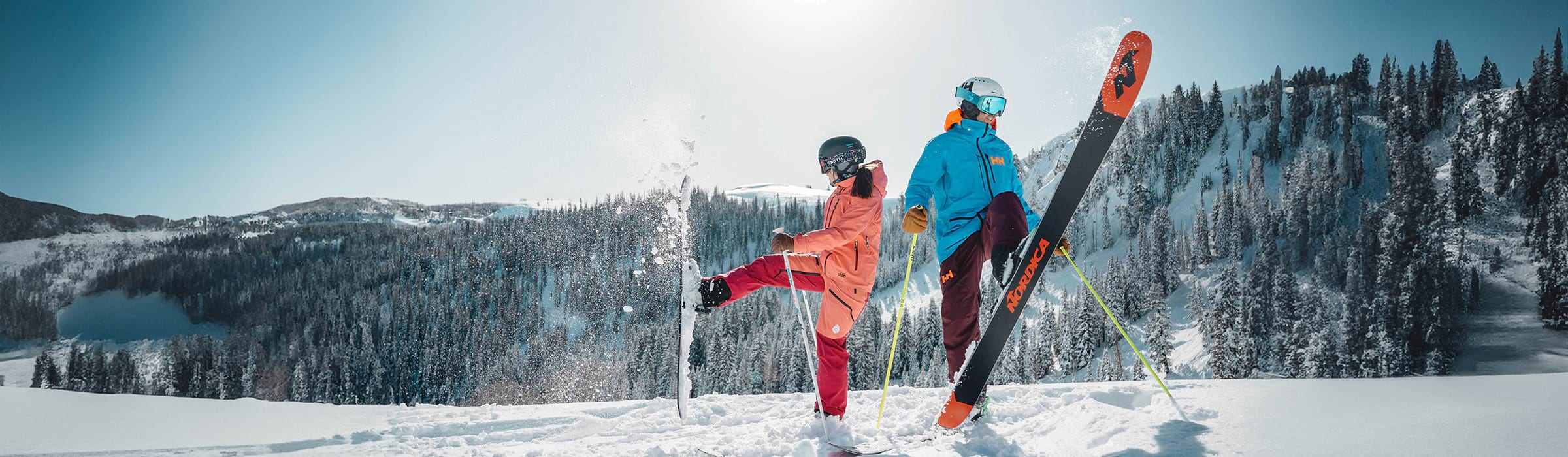 Two guests skiing at Deer Valley on a powder day.