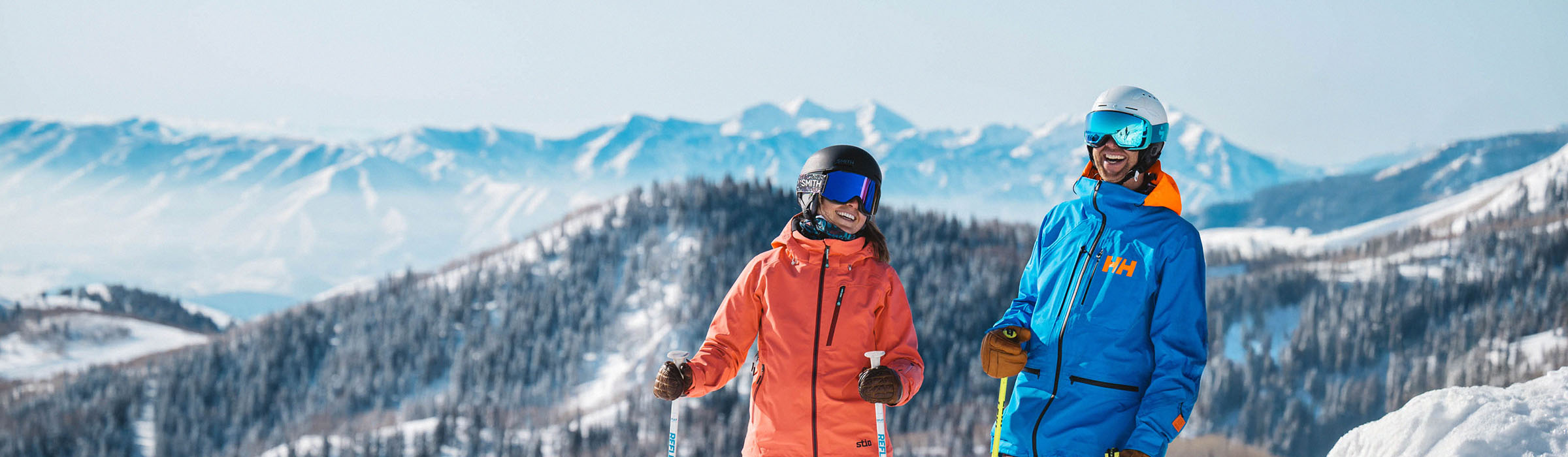 Two skiers laughing on the mountain at Deer Valley Resort